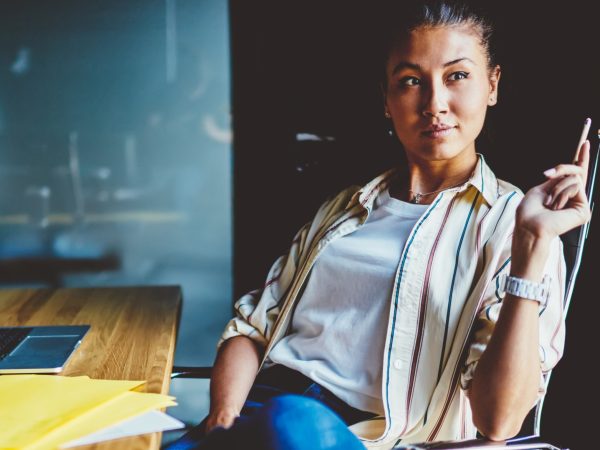 Woman_Looking_Out_Window_Computer_AdobeStock_670043710_Smaller